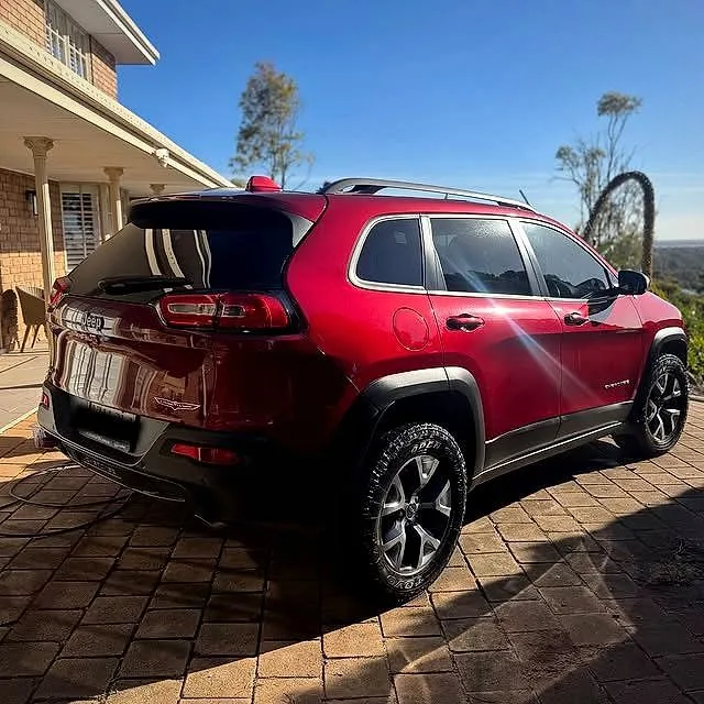 Red Jeep Cherokee after a mobile wash