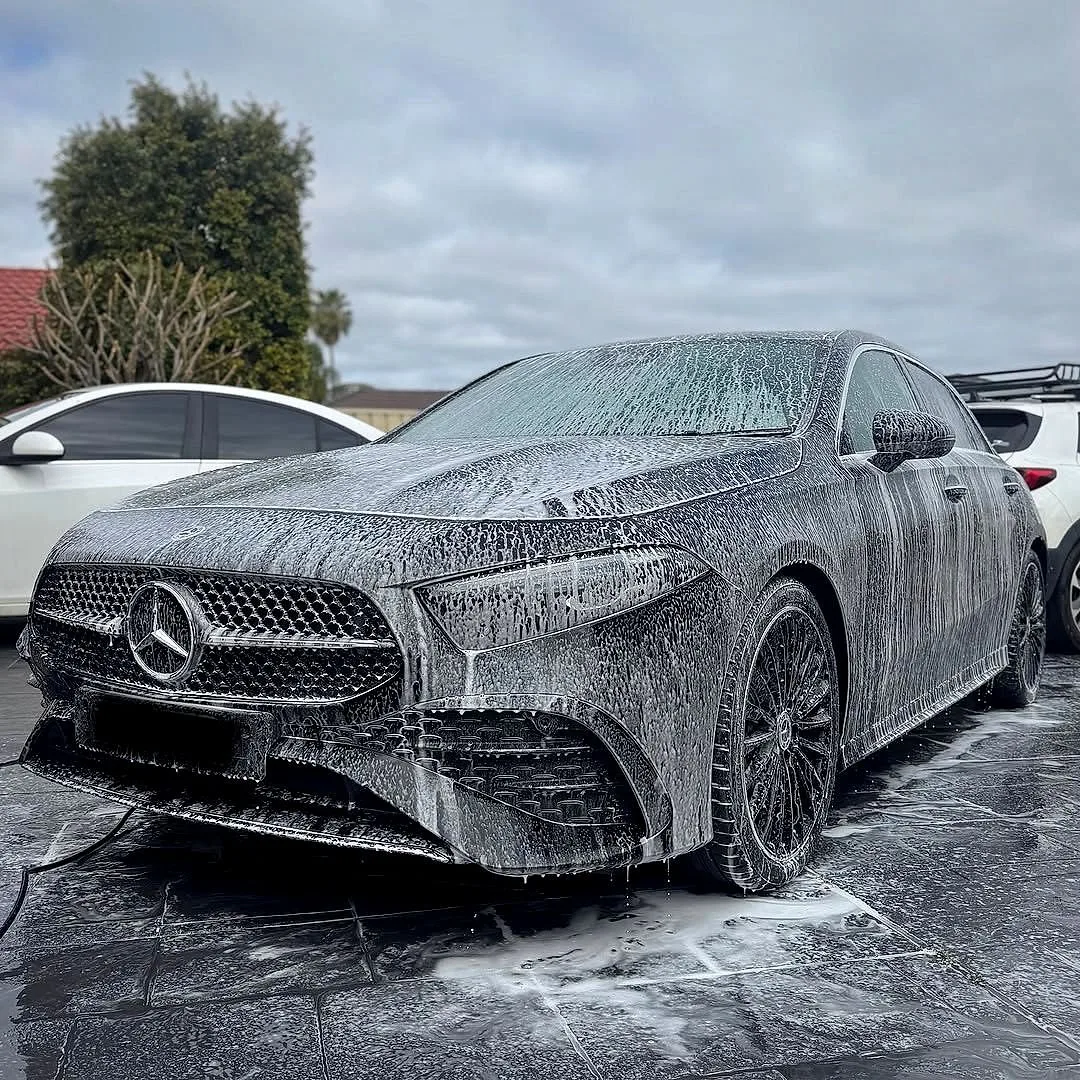 Mercedes covered in snow foam during a mobile wash by OP Car Cleaning